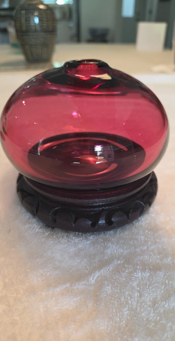 Decorative Ruby Red Glass Globe on Carved Wood Base